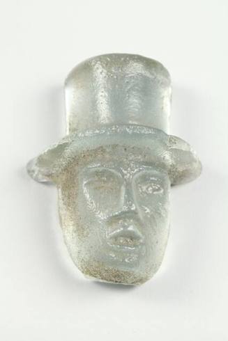 Untitled (Cast glass face with hat)